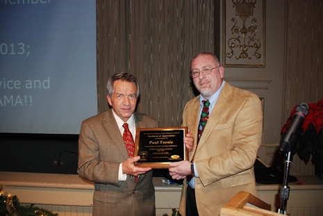 Paul Tursic receives plaque from Jeff Gruber