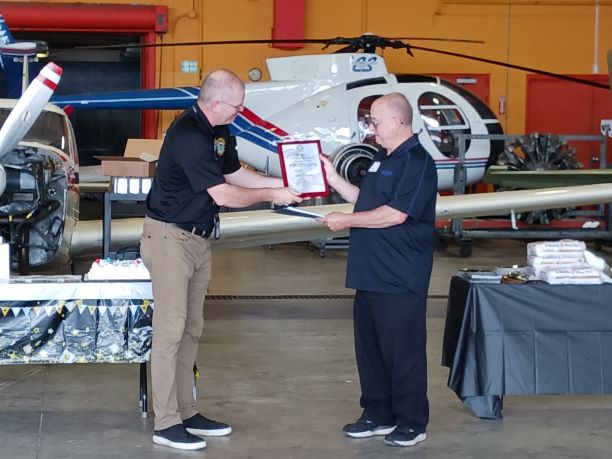 Gene receives Charles Taylor Award from FAA Safety Inspector Paul Gillenwater.